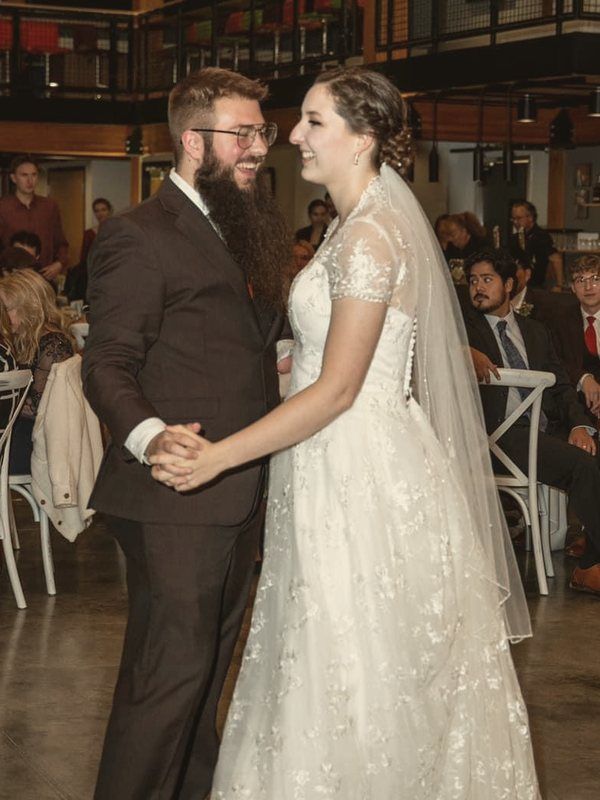 Christian and his wife sharing their first dance at their wedding